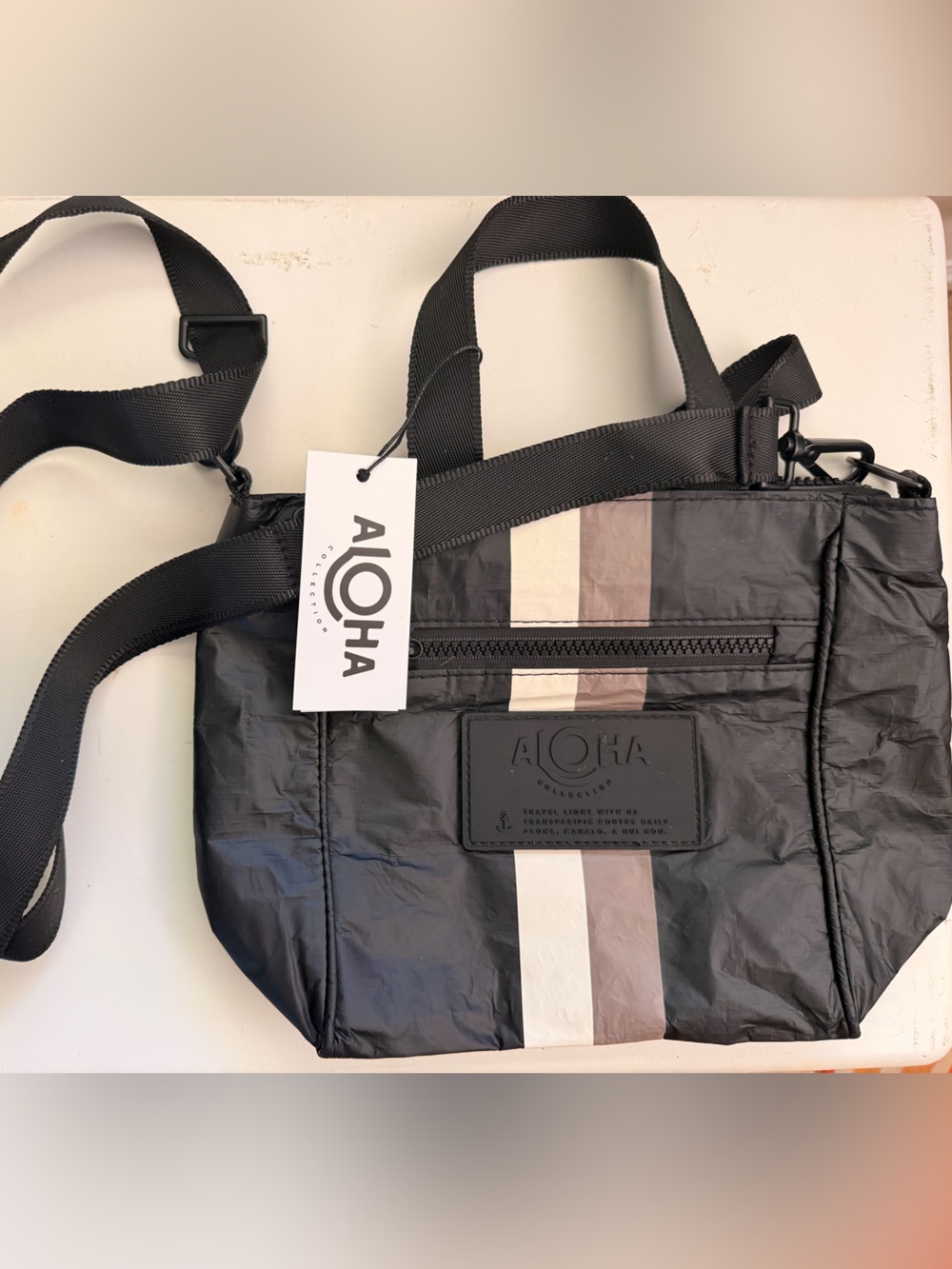 Aloha Collection Black Crossbody Bag with Neutral Stripes